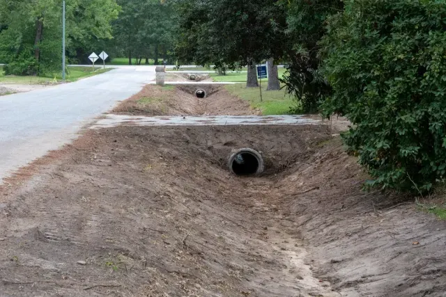 Culvert and creek crossing installation with engineered drainage flow control featuring culvert flowline setup with inlet and outlet stabilization in Post Falls, Coeur d'Alene, and North Idaho
