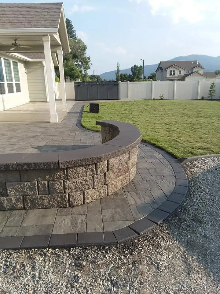 Driveway and approach construction with durable base prep and drainage control featuring driveway base preparation with approach grading and edge control in Post Falls, Coeur d'Alene, and North Idaho