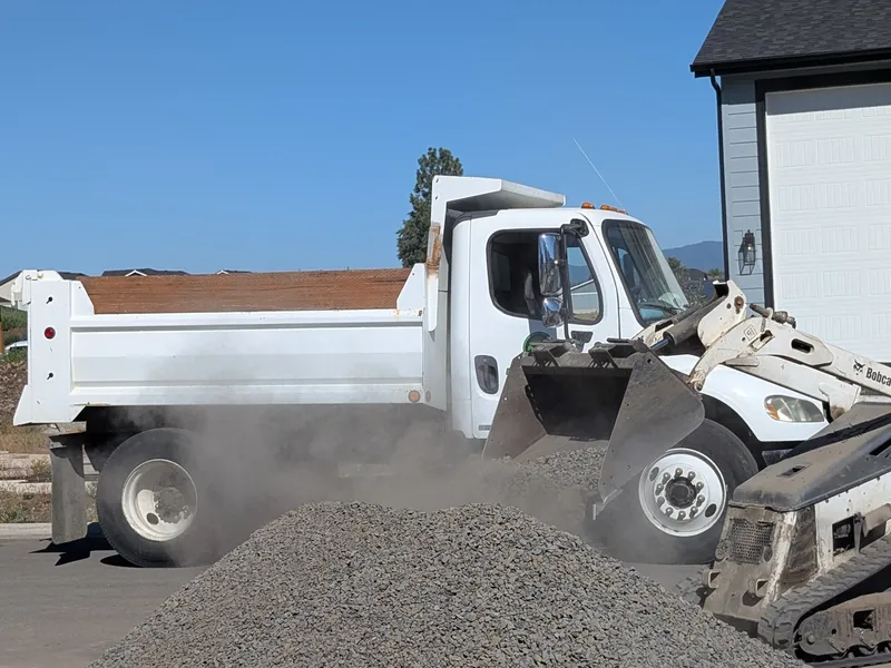 Excavation and grading work for site preparation featuring grade verification supporting reliable drainage direction in Post Falls, Coeur d'Alene, and North Idaho
