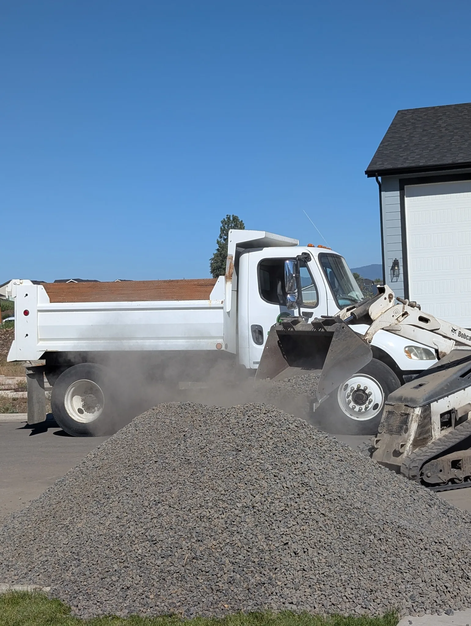 Excavation and grading work for site preparation featuring grade verification supporting reliable drainage direction in Post Falls, Coeur d'Alene, and North Idaho