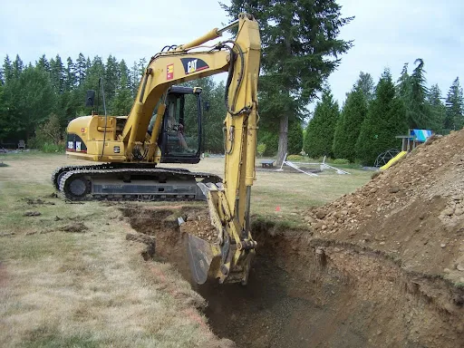 Excavation and grading work for site preparation featuring septic prep excavation and field layout coordination in Post Falls, Coeur d'Alene, and North Idaho