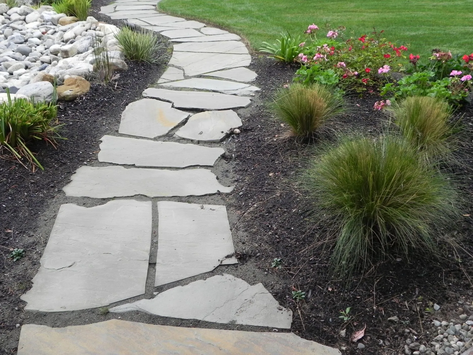 Landscaping project image featuring seasonal color layering supporting long-term plant performance in Post Falls, Coeur d'Alene, and North Idaho