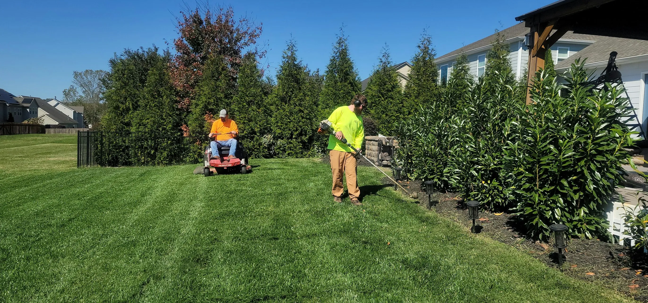 Landscaping project image featuring seasonal color layering supporting cohesive outdoor-room flow in Post Falls, Coeur d'Alene, and North Idaho