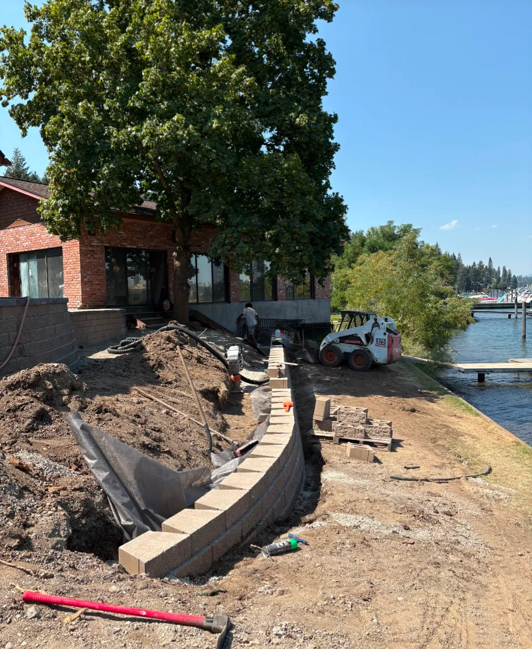 Patio and paving installation with custom stone layout and edge definition featuring stone layout geometry with clean joints and edge restraint in Post Falls, Coeur d'Alene, and North Idaho