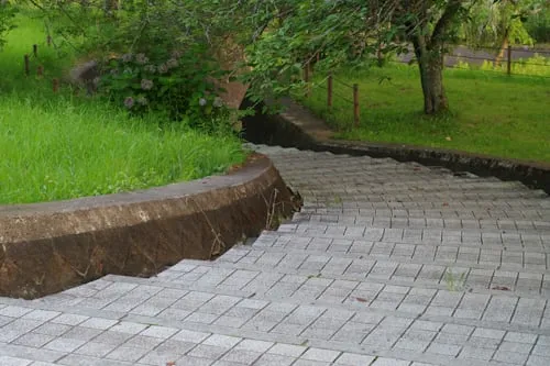 Patio and paving installation with custom stone layout and edge definition featuring stone layout geometry with clean joints and edge restraint in Post Falls, Coeur d'Alene, and North Idaho