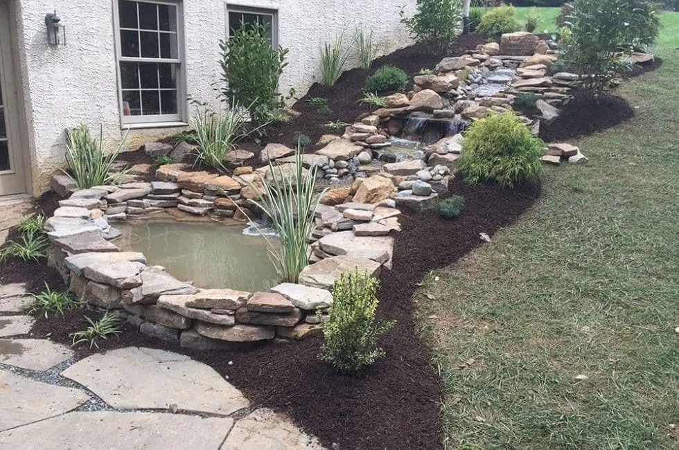 Excavation and grading work for site preparation featuring pond basin shaping and water feature earthwork in Post Falls, Coeur d'Alene, and North Idaho