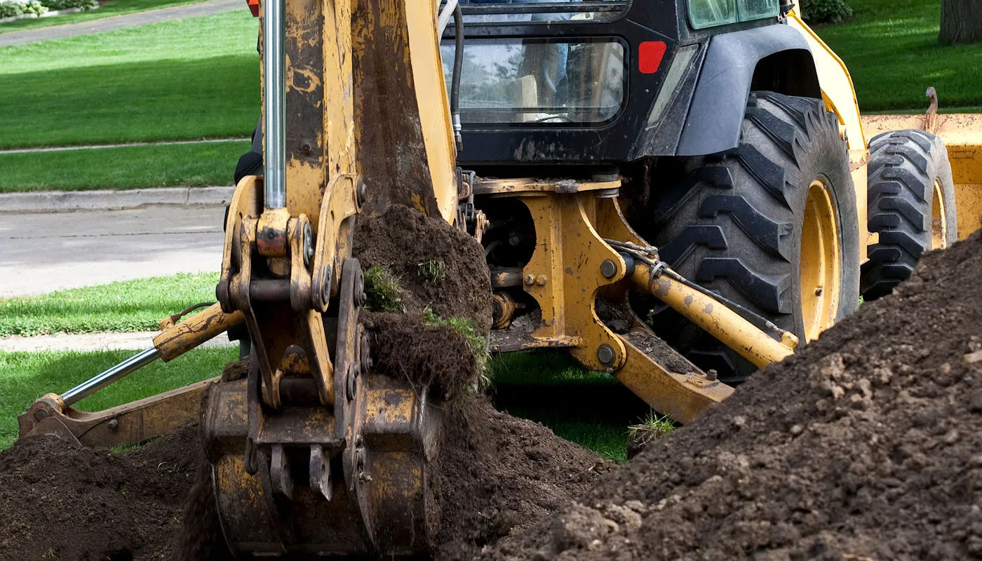 Excavation and grading work for site preparation featuring pond basin shaping and water feature earthwork in Post Falls, Coeur d'Alene, and North Idaho
