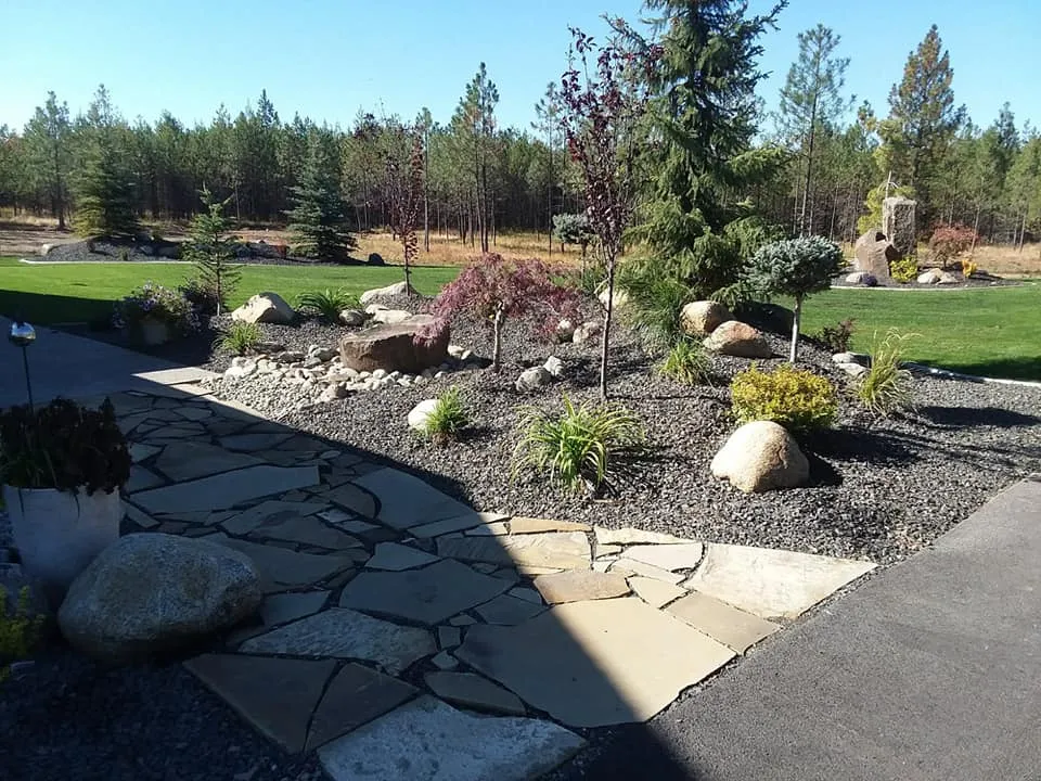 Landscaping project image featuring grade blending supporting cohesive outdoor-room flow in Post Falls, Coeur d'Alene, and North Idaho, gallery view 2