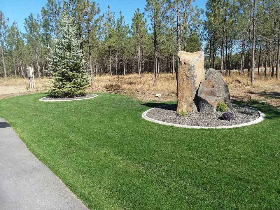 Maintenance project image featuring pond basin shaping and water feature earthwork in Post Falls, Coeur d'Alene, and North Idaho